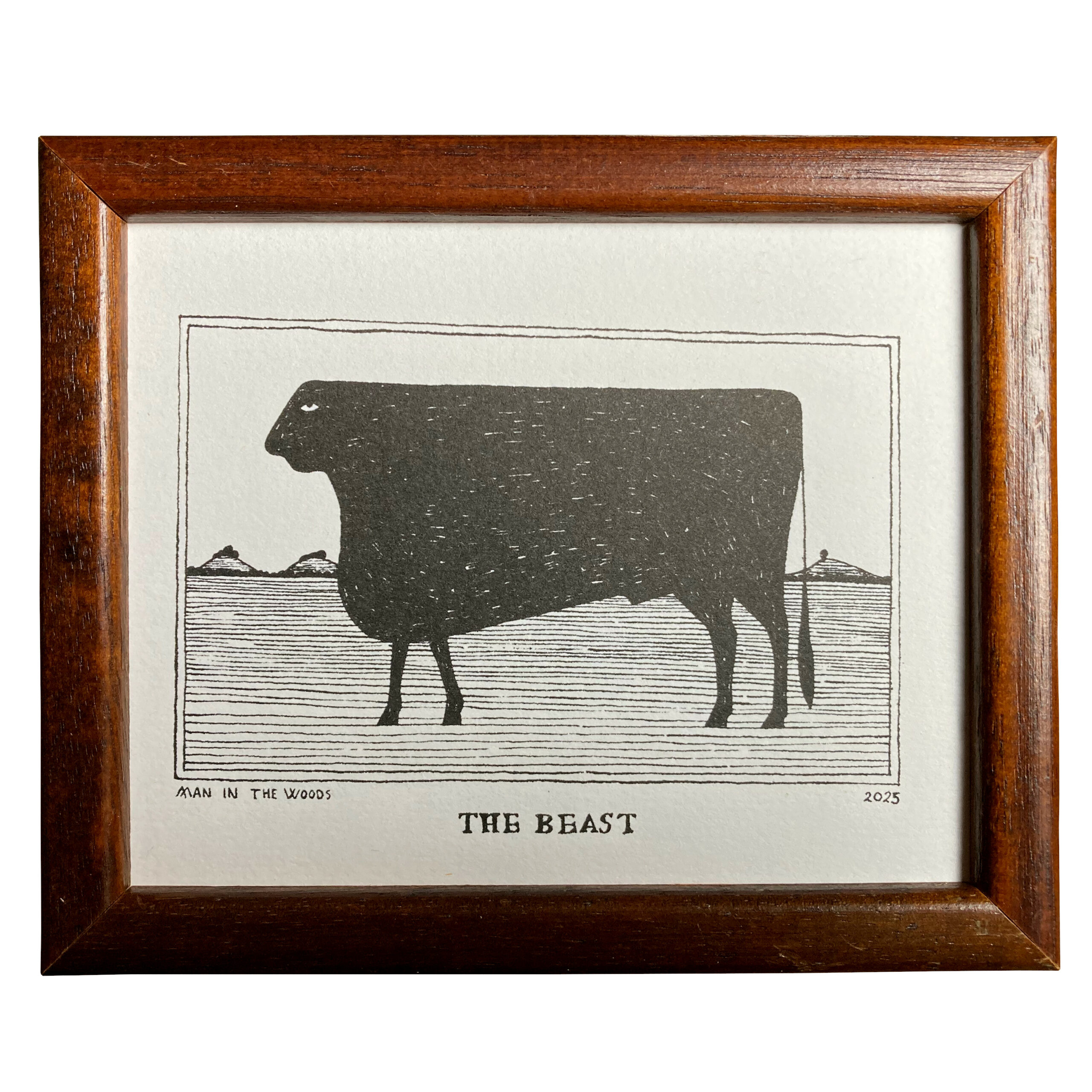 The Beast, an artwork by Man in the Woods, of a very large cow: a dark silhouette against a rural background of field and hills.